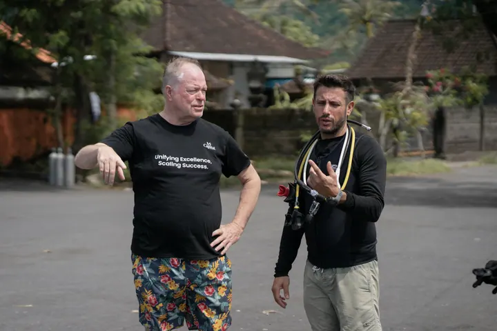 An MS Capital volunteer speaking with a diver before an ocean cleanup in Bali
